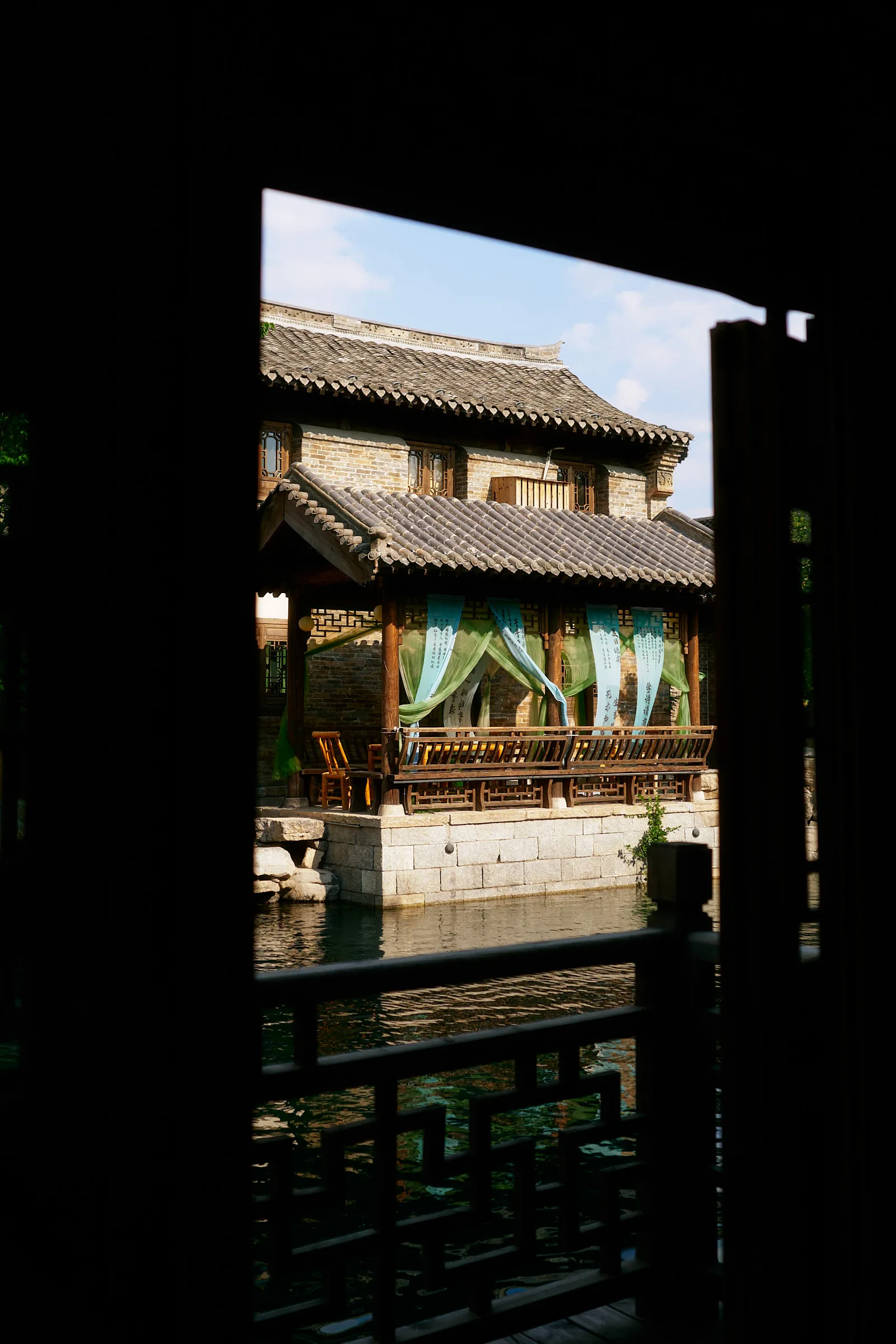 Photo of a chinese traditional building framed through a door
